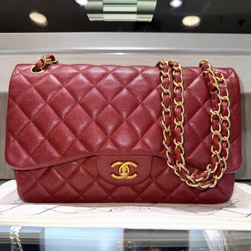 Pre-owned Chanel Classic Jumbo Double Flap in Iridescent Burgundy Quilted Caviar leather with antique gold-tone hardware
