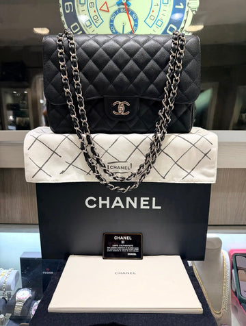 Pre-owned Chanel Classic Jumbo Double Flap in black caviar leather with silver hardware (2017–2018)