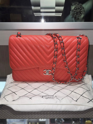 Pre-owned Chanel Jumbo Caviar Chevron Coral double flap SHW with duster and box (2018 Collection)