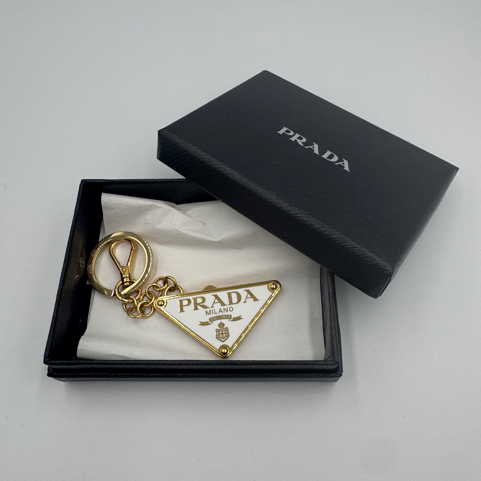 Pre-owned Prada Keychain White and Gold with box and tags