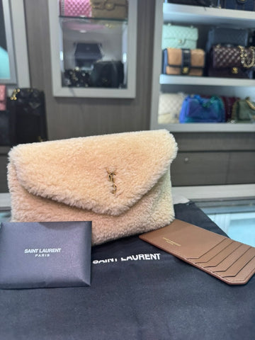 Unworn YSL Saint Laurent shearling pouch with wallet