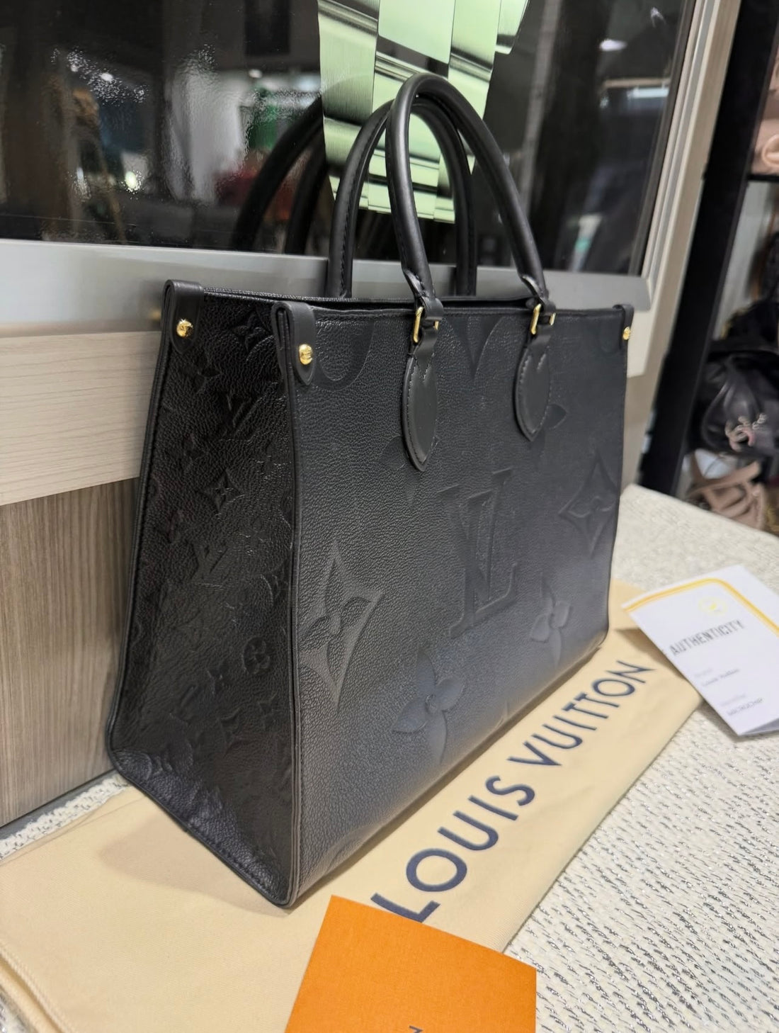 Preowned Louis Vuitton OntheGo MM Black Empreinte Tote